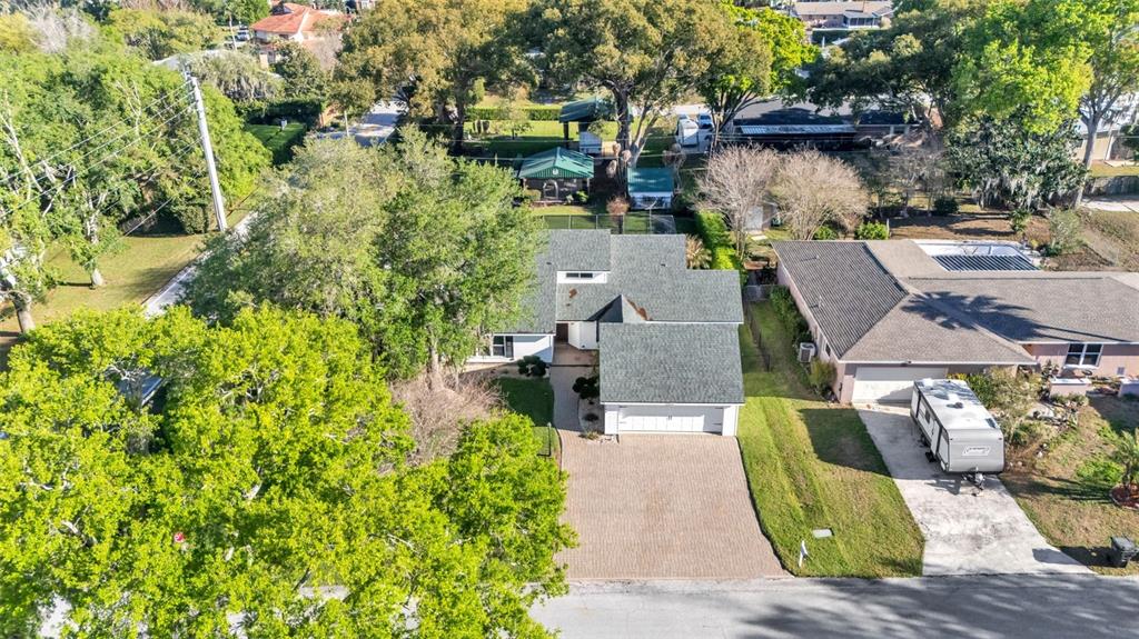 1804 Michelle Lane Lakeland, FL 33813 - Photo 2 of 83 an aerial view of a house with a garden and lake view