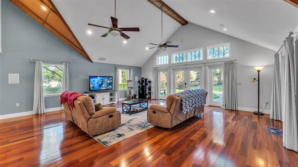 1804 Michelle Lane Lakeland, FL 33813 - Photo 22 of 83 a living room with furniture a ceiling fan and a wooden floor
