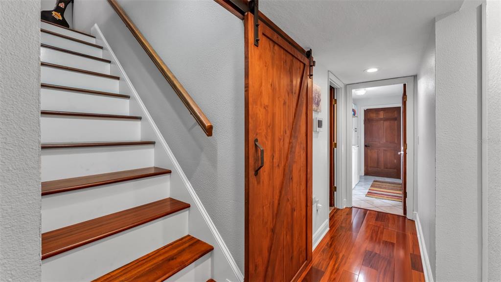 1804 Michelle Lane Lakeland, FL 33813 - Photo 38 of 83 a view of entryway with wooden floor and stairs