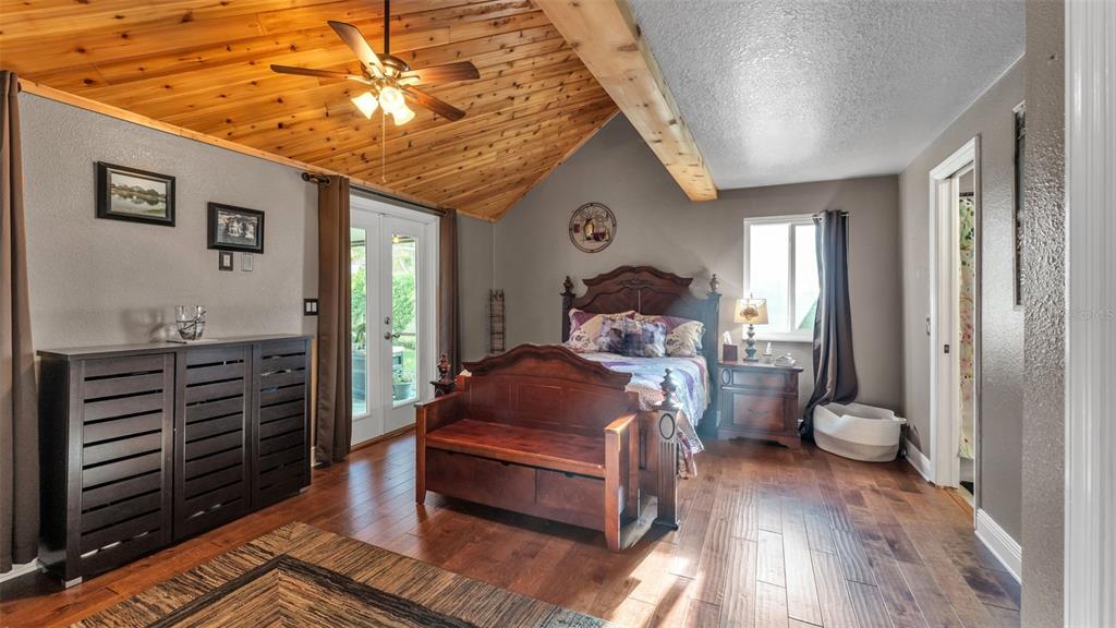 1804 Michelle Lane Lakeland, FL 33813 - Photo 39 of 83 a bed room with a bed and a chandelier