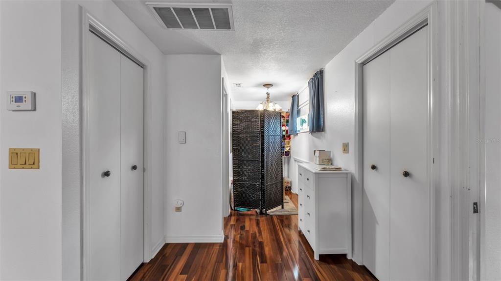 1804 Michelle Lane Lakeland, FL 33813 - Photo 51 of 83 a view of a hallway with wooden floor and staircase
