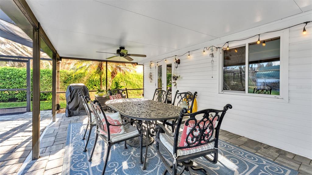 1804 Michelle Lane Lakeland, FL 33813 - Photo 58 of 83 a dining room with furniture a chandelier and wooden floor