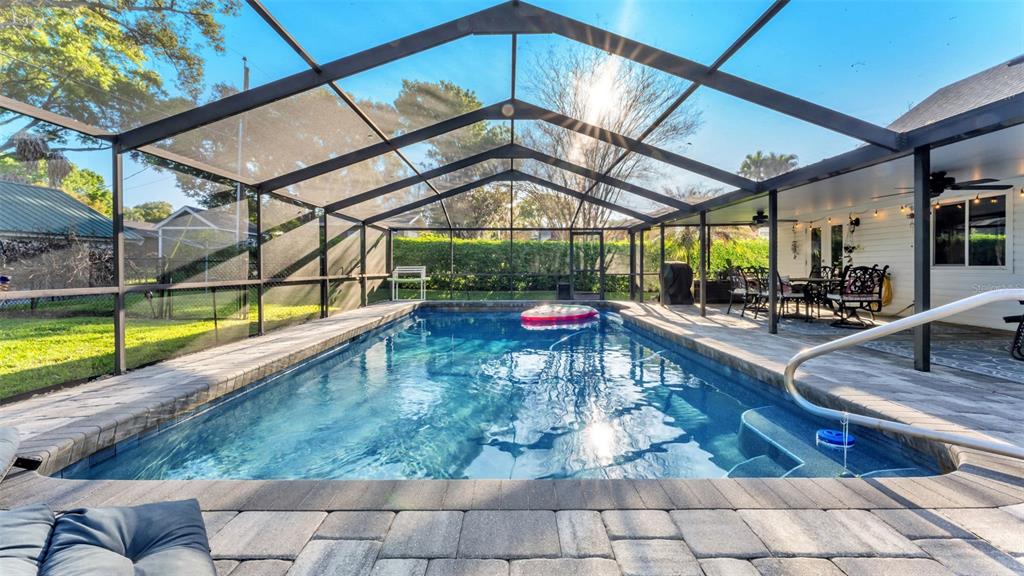 1804 Michelle Lane Lakeland, FL 33813 - Photo 63 of 83 a view of a swimming pool with a couches in patio