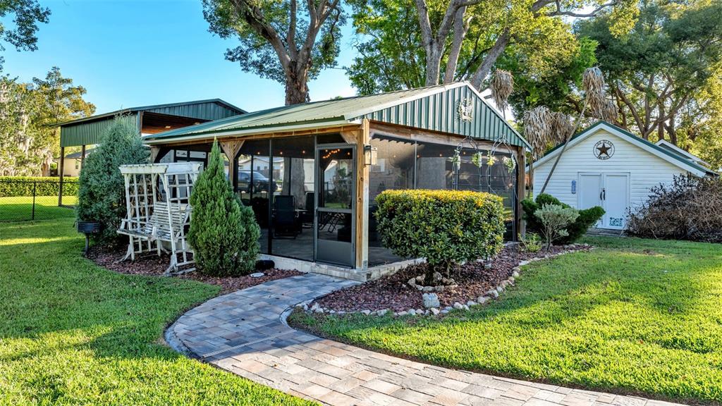 1804 Michelle Lane Lakeland, FL 33813 - Photo 67 of 83 a view of a chair and table in backyard of the house