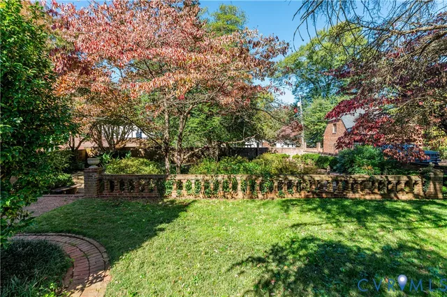 a view of a house with a tree