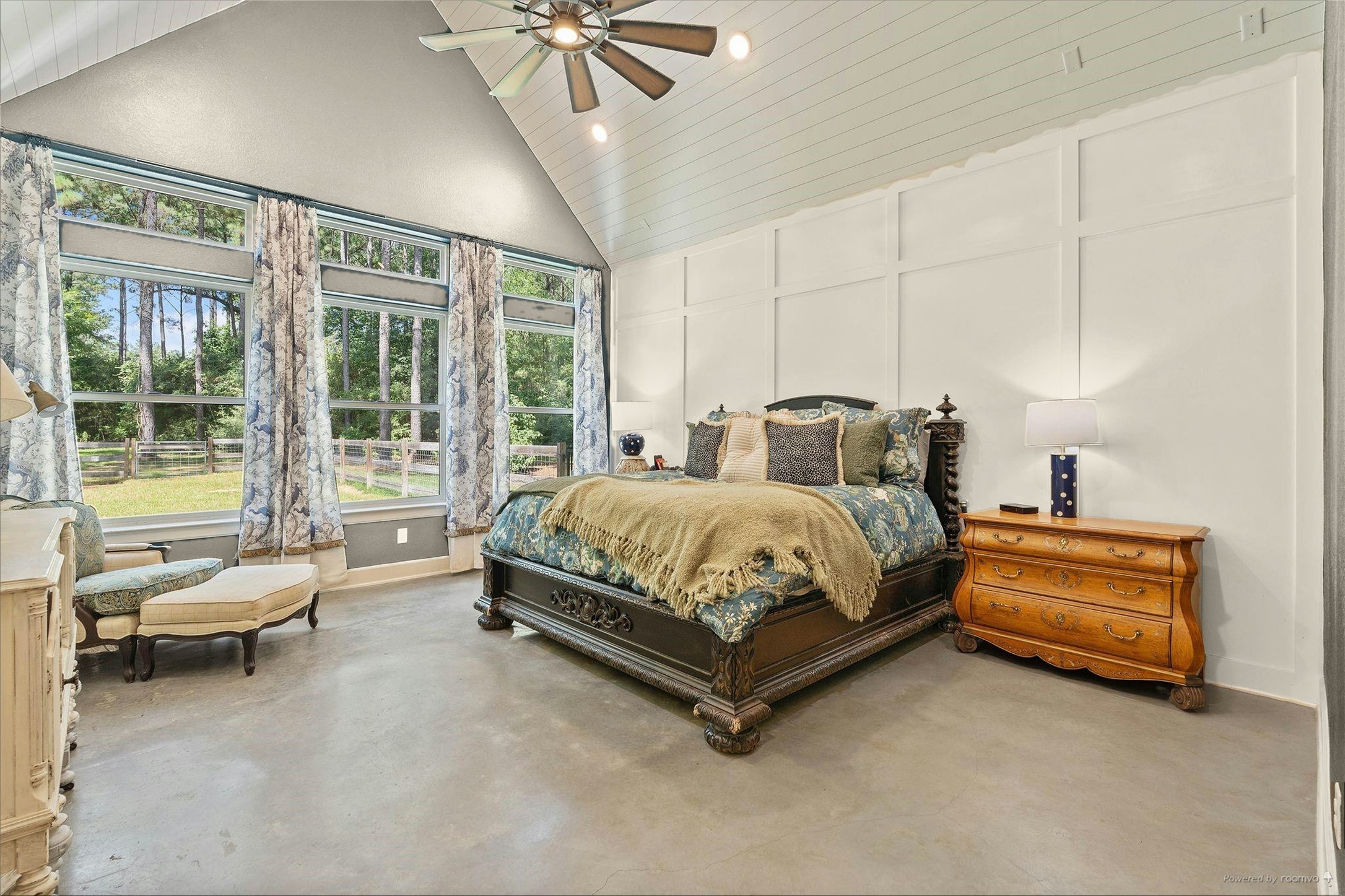 126 Fluorite Court Huntsville, TX 77340 - Photo 18 of 50 a bedroom with a bed and a chandelier