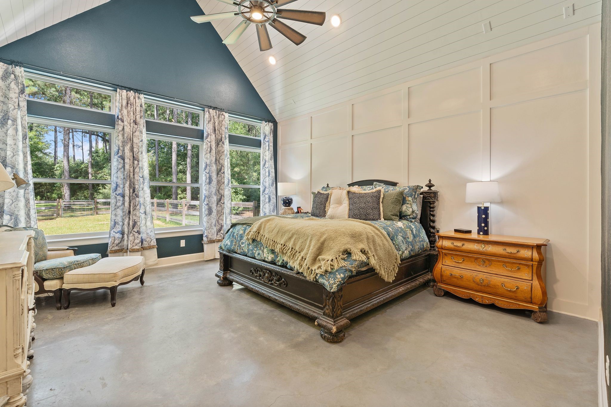 126 Fluorite Court Huntsville, TX 77340 - Photo 19 of 50 a spacious bedroom with a bed and a chandelier