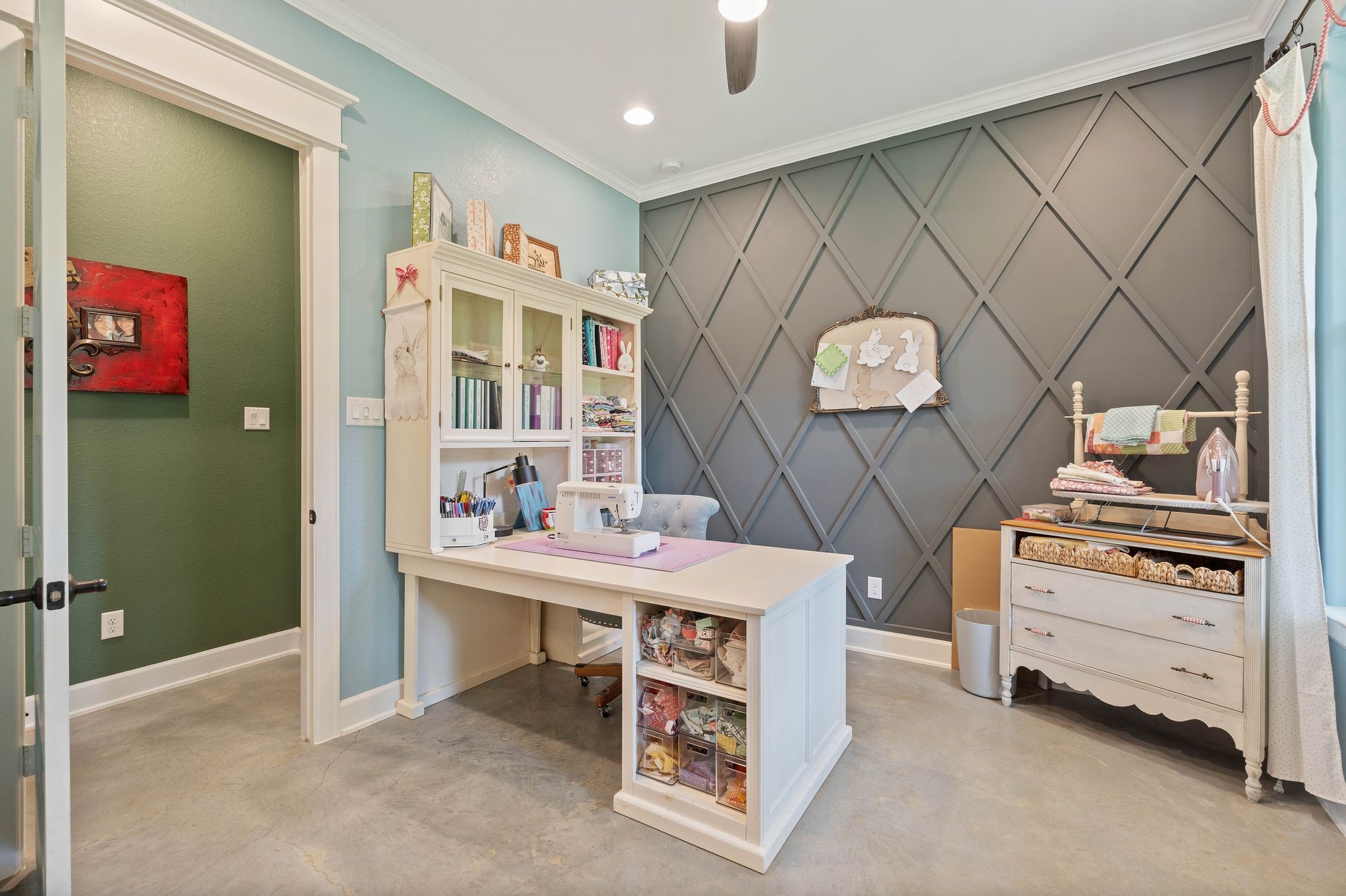 126 Fluorite Court Huntsville, TX 77340 - Photo 29 of 50 a room with cabinets and a wooden floor