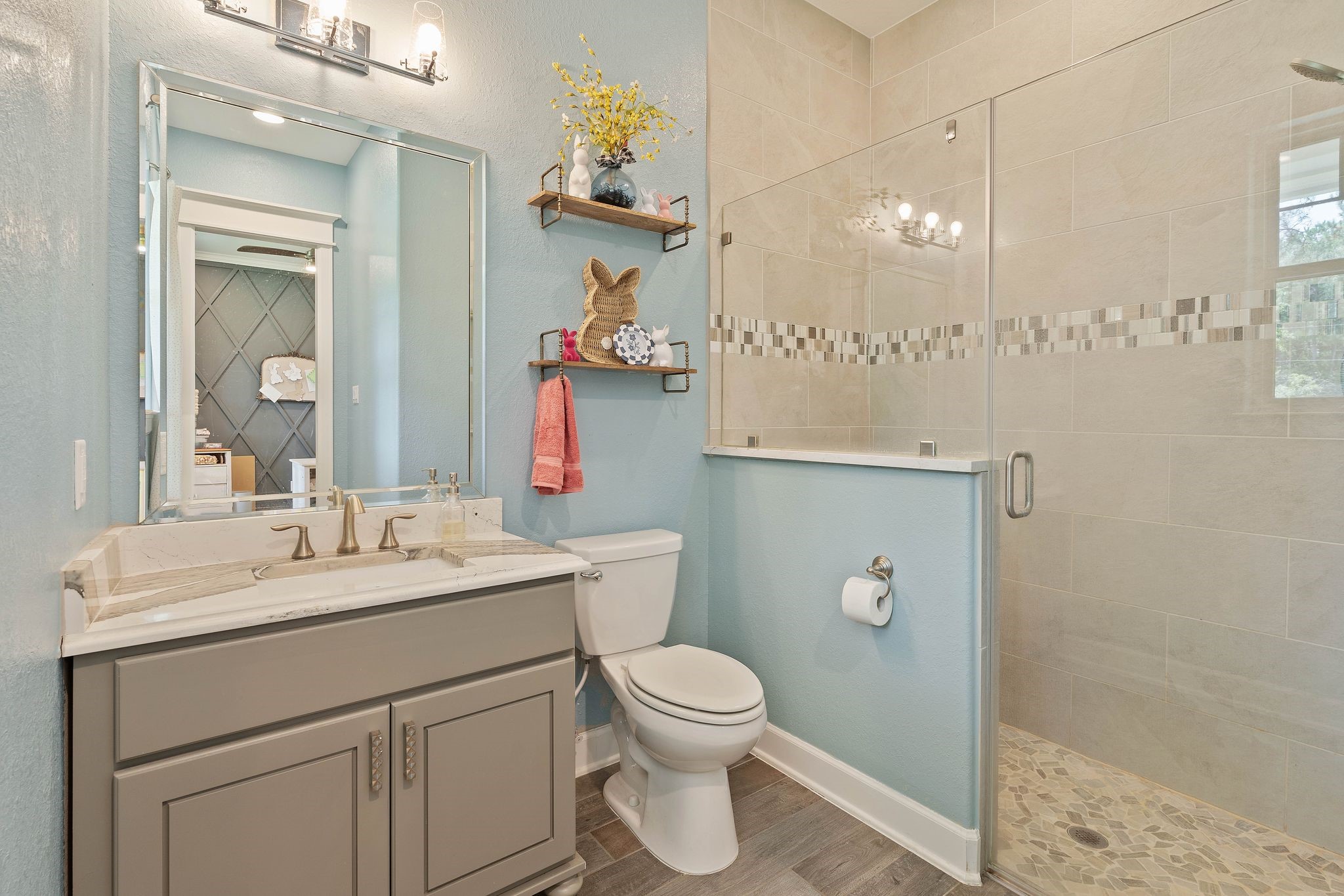 126 Fluorite Court Huntsville, TX 77340 - Photo 31 of 50 a bathroom with a toilet sink and mirror