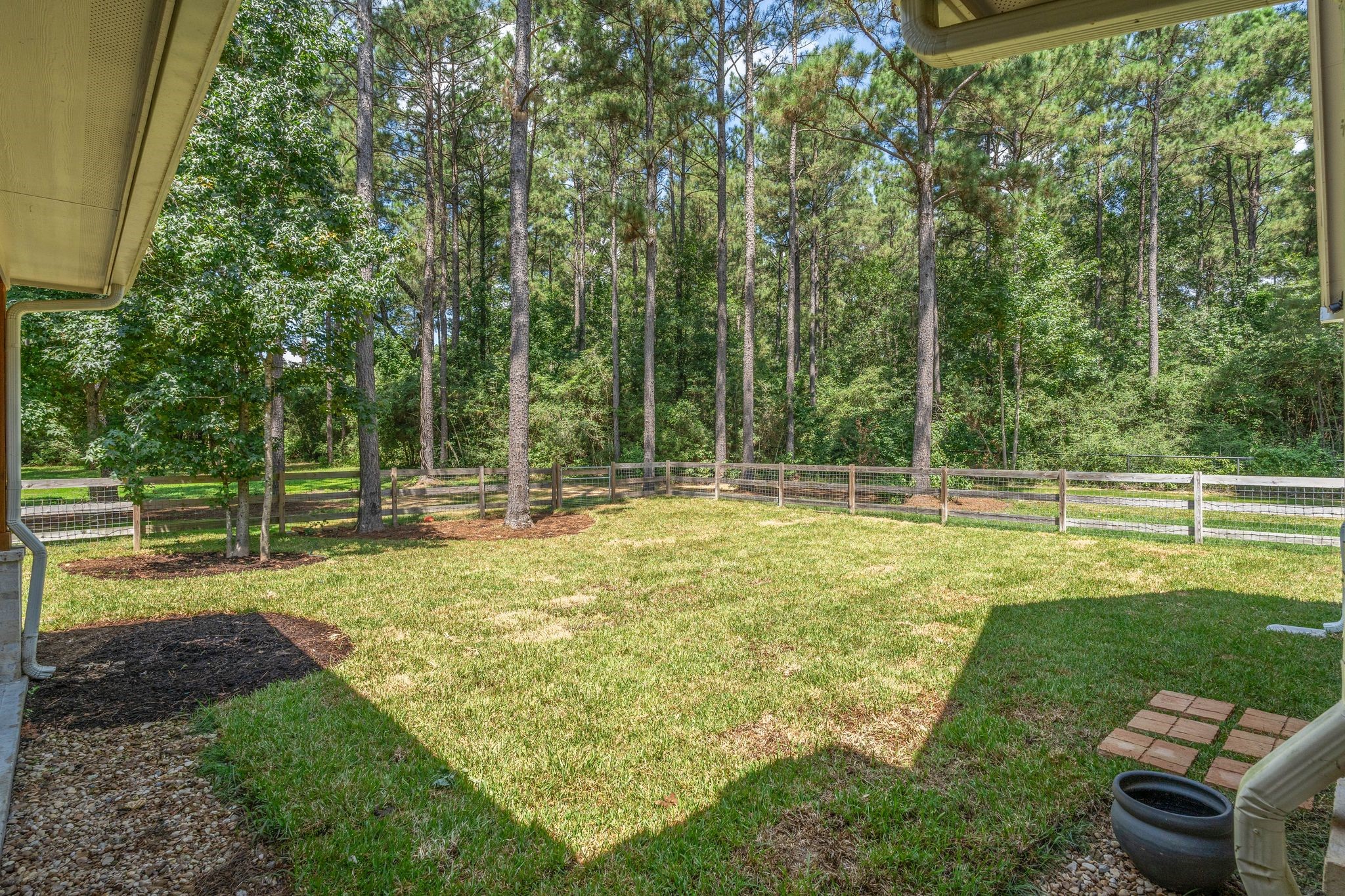 126 Fluorite Court Huntsville, TX 77340 - Photo 33 of 50 a view of a backyard with swimming pool
