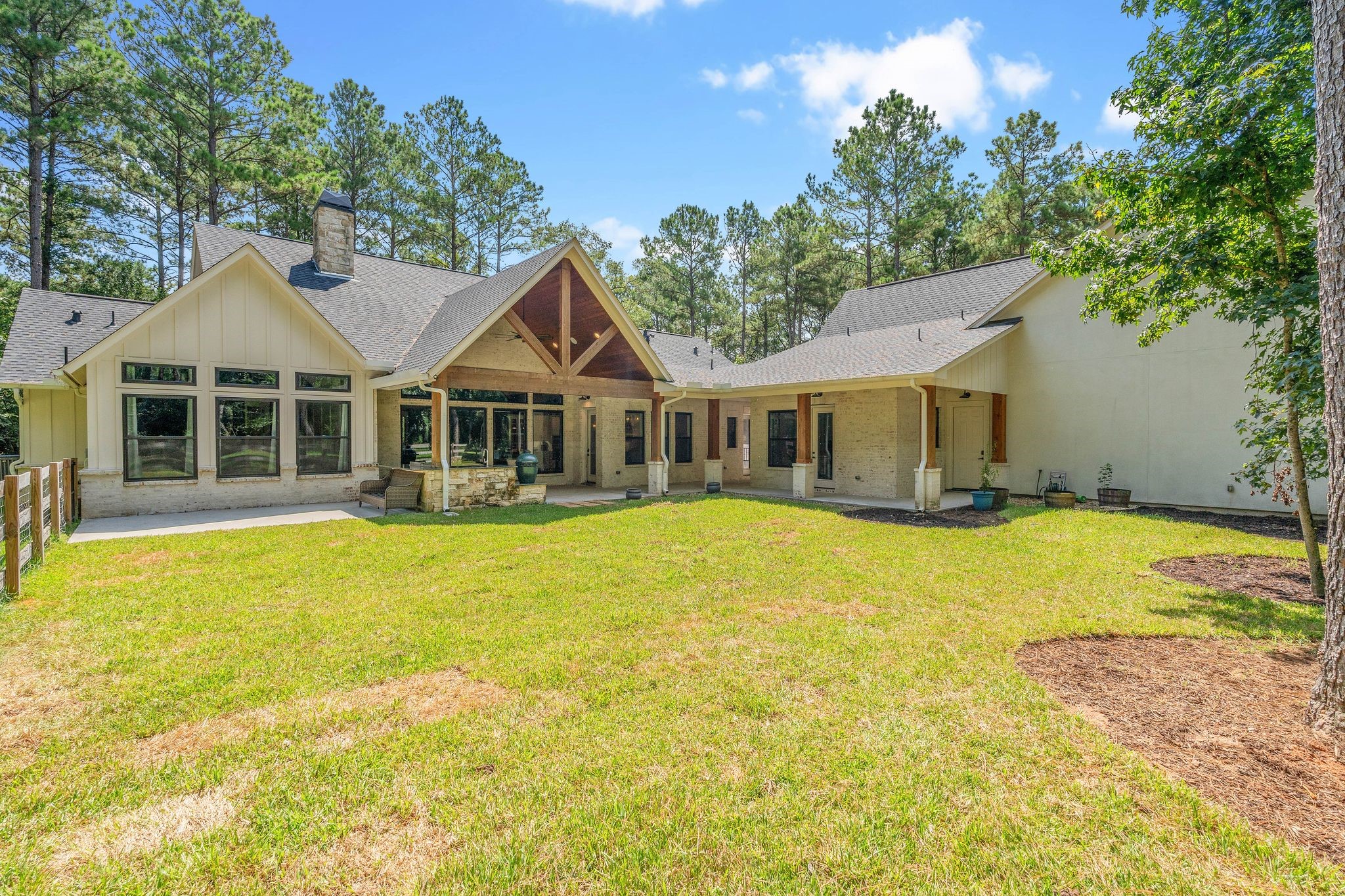 126 Fluorite Court Huntsville, TX 77340 - Photo 34 of 50 a front view of a house with swimming pool and porch