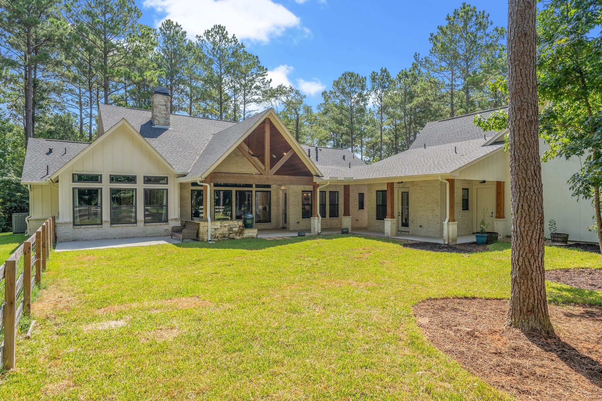 126 Fluorite Court Huntsville, TX 77340 - Photo 35 of 50 a front view of a house with swimming pool
