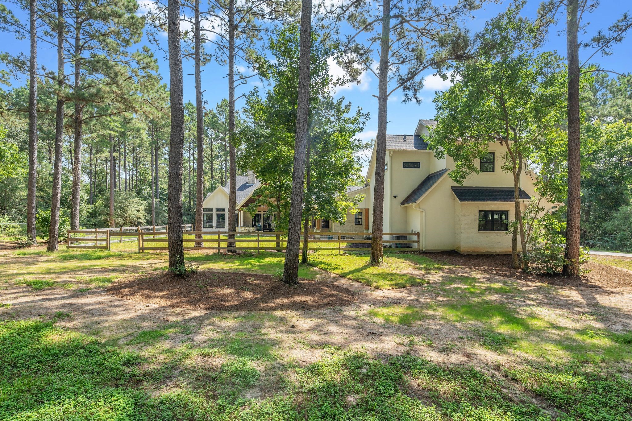 126 Fluorite Court Huntsville, TX 77340 - Photo 43 of 50 a view of a yard with a house
