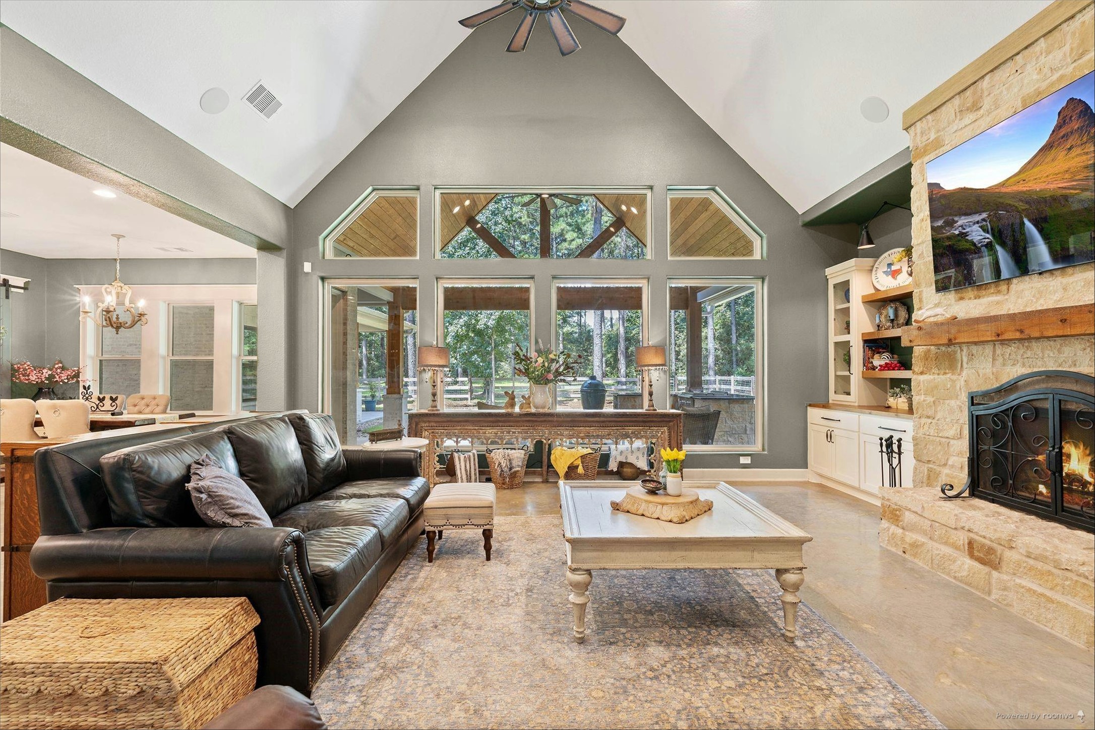 126 Fluorite Court Huntsville, TX 77340 - Photo 7 of 50 a living room with furniture a fireplace and a floor to ceiling window