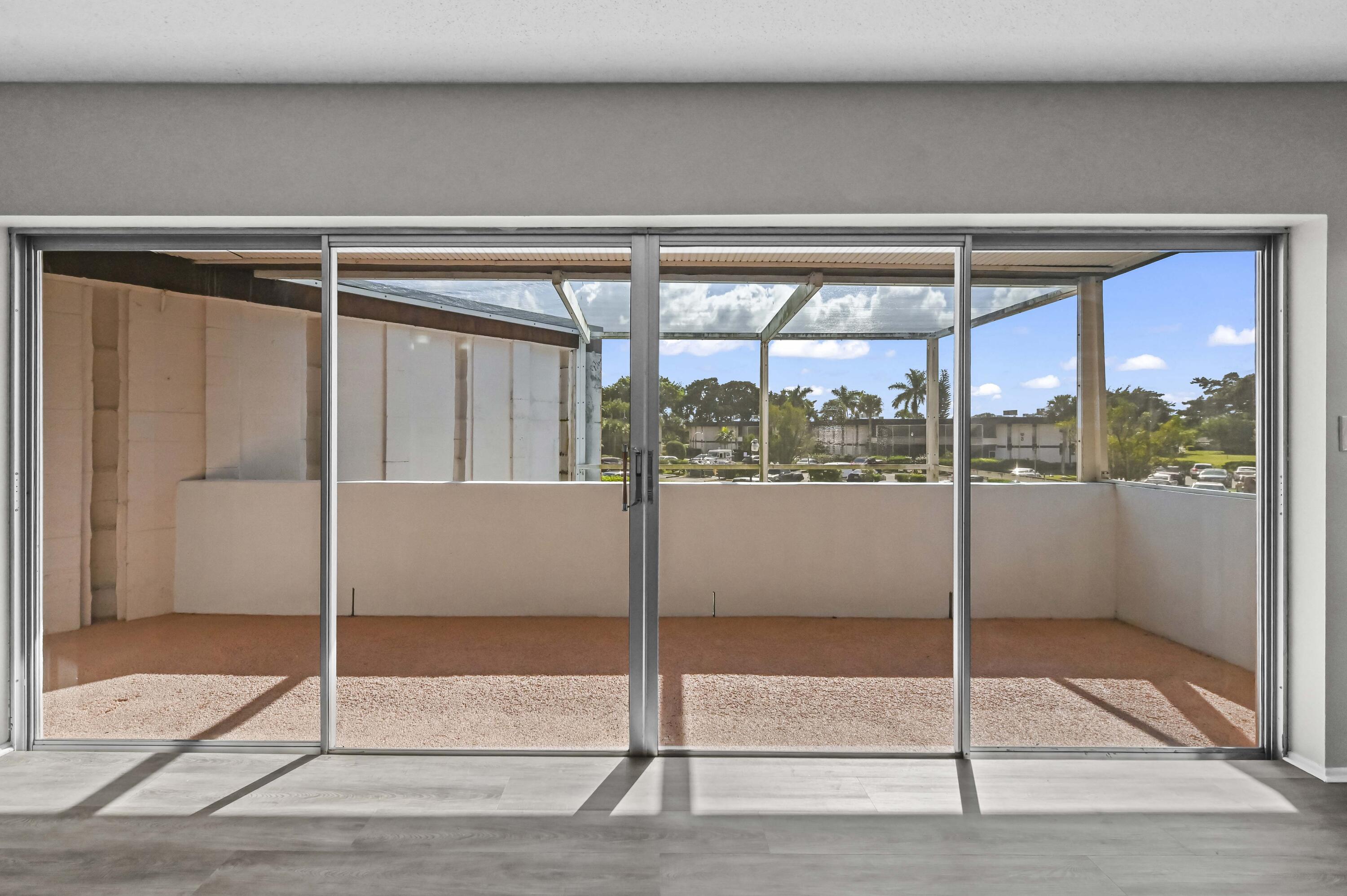 6 Greenway N Royal Palm Beach North, Unit 212 Royal Palm Beach, FL 33411 - Photo 15 of 23 a glass door and window