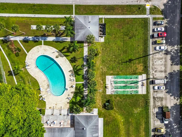 an aerial view of residential houses with outdoor space
