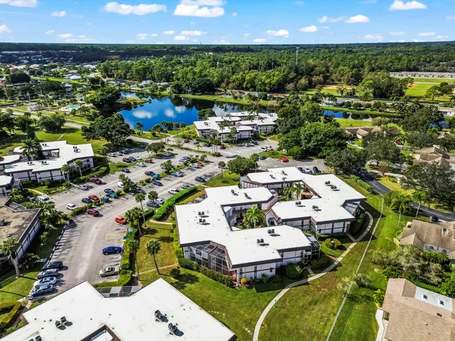 an aerial view of a house with a lake view