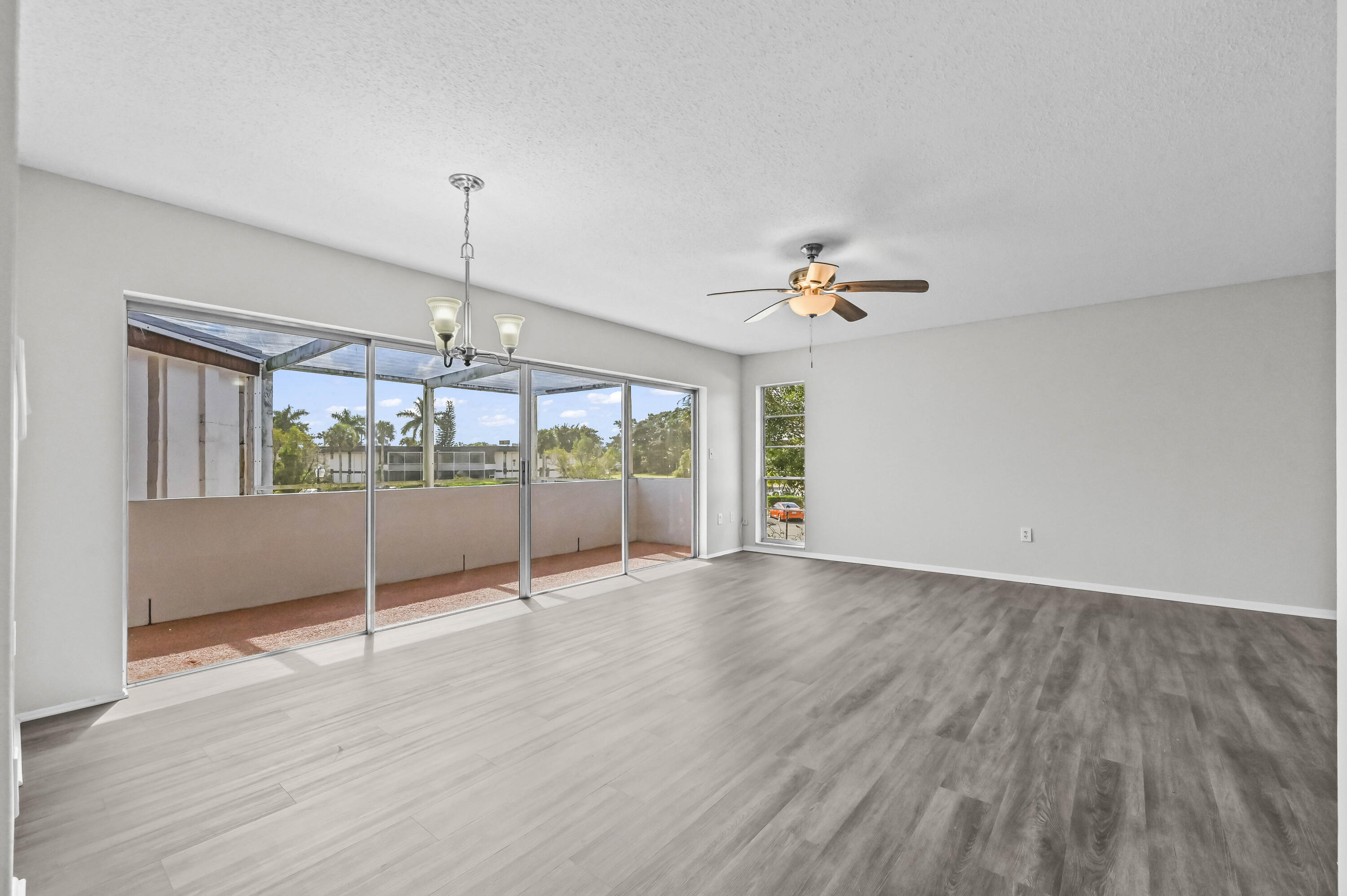 6 Greenway N Royal Palm Beach North, Unit 212 Royal Palm Beach, FL 33411 - Photo 4 of 23 a view of an empty room with a window