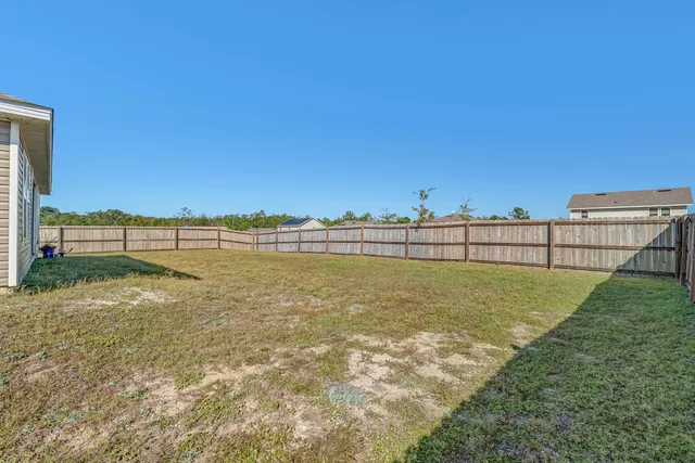 a view of backyard and entertaining space