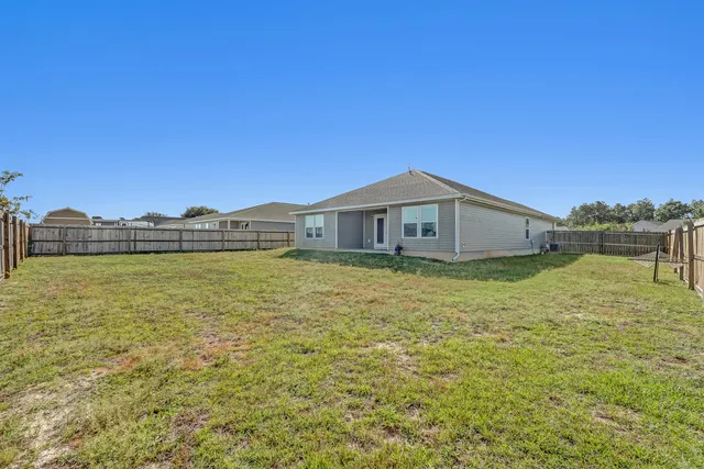 a view of a yard next to a building