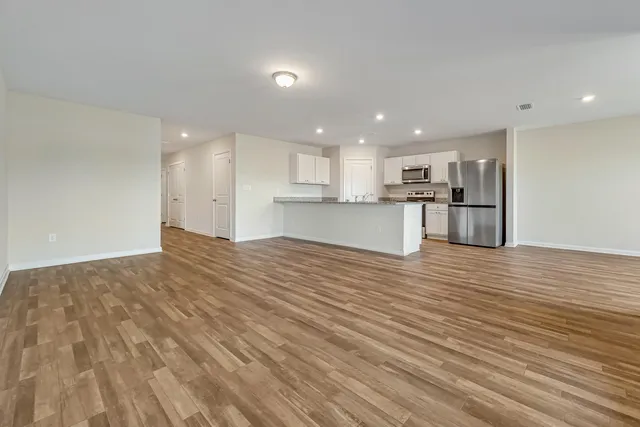 a view of kitchen and wooden floor