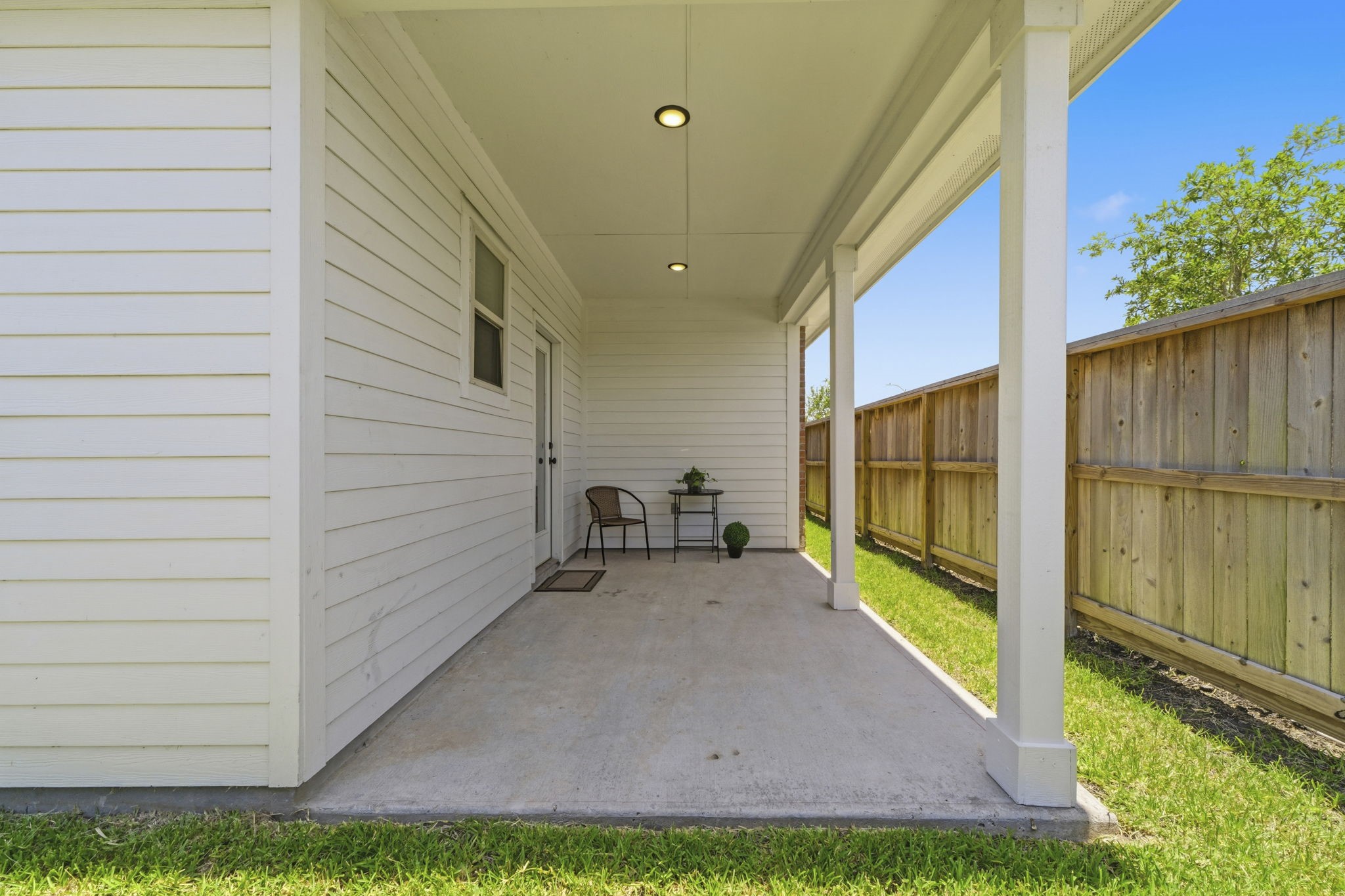 10934 Bonfire Trail Beasley, TX 77417 - Photo 22 of 32 Enjoy outdoor living on the covered patio with a fully fenced backyard.