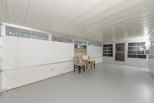 a view of workspace with furniture and window