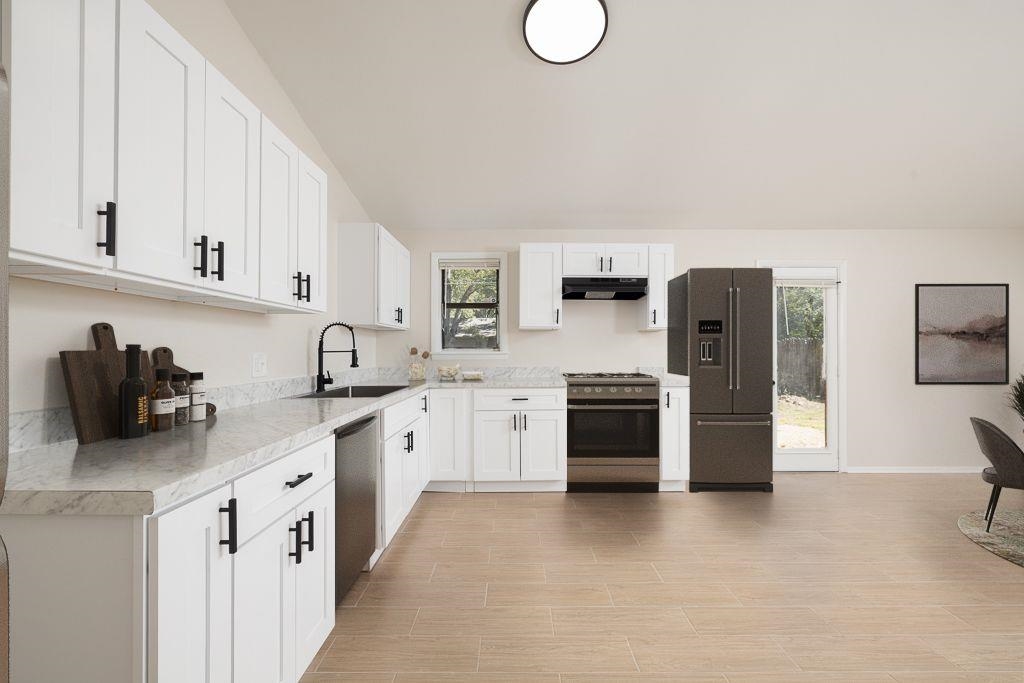 a kitchen with a sink stove and refrigerator