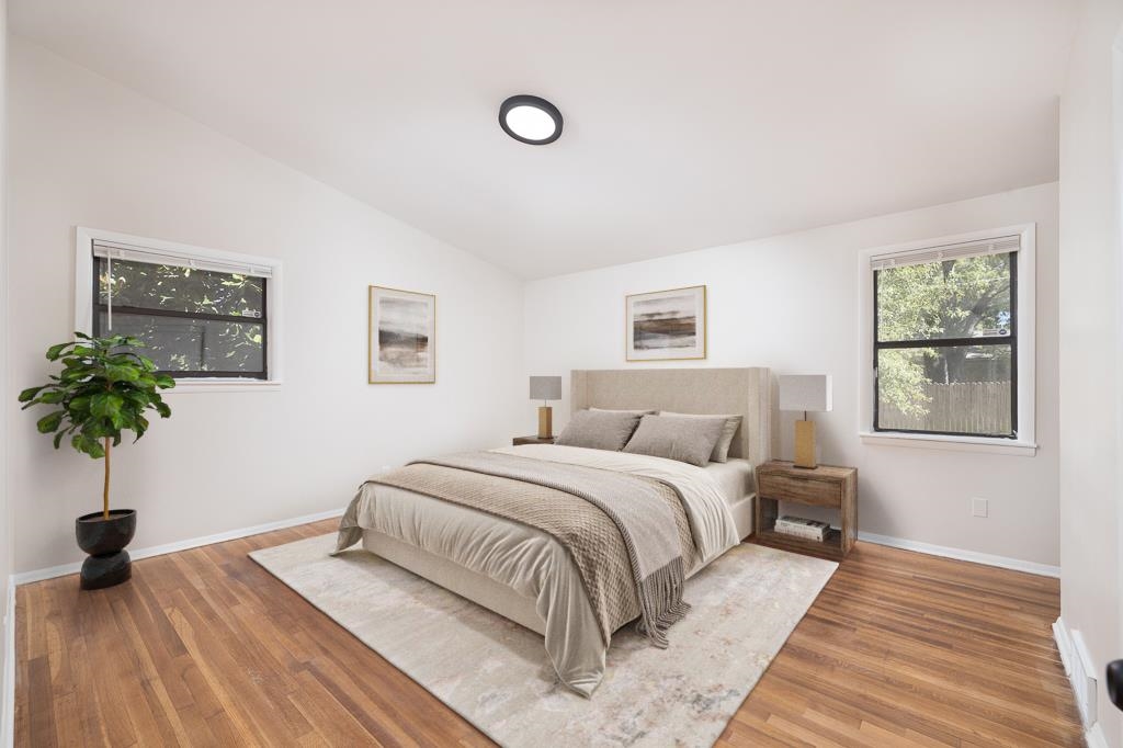 4512 Applegate Road Memphis, TN 38109 - Photo 16 of 31 a bedroom with a bed and a potted plant