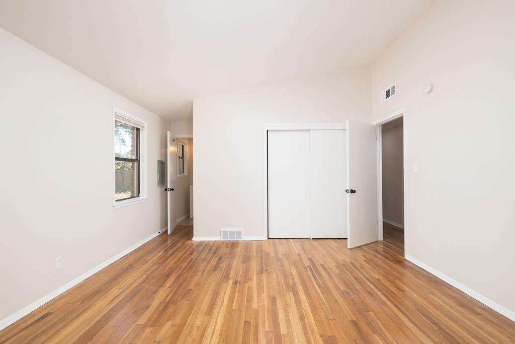 4512 Applegate Road Memphis, TN 38109 - Photo 17 of 31 a view of a room with wooden floor and white walls