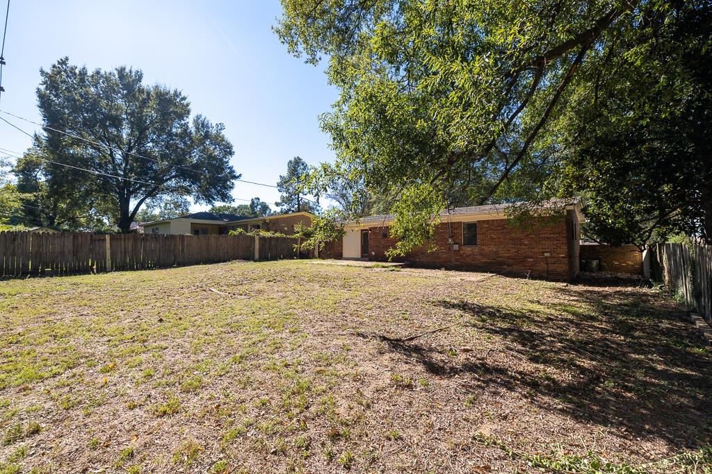 4512 Applegate Road Memphis, TN 38109 - Photo 22 of 31 a house with a yard