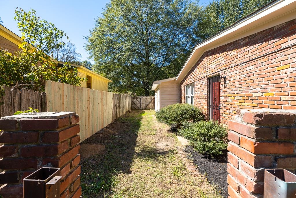4512 Applegate Road Memphis, TN 38109 - Photo 25 of 31 a view of a house with backyard and sitting area