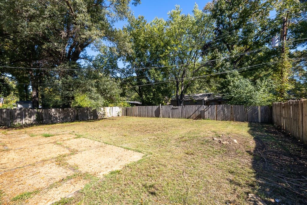 4512 Applegate Road Memphis, TN 38109 - Photo 27 of 31 a house with trees in the background
