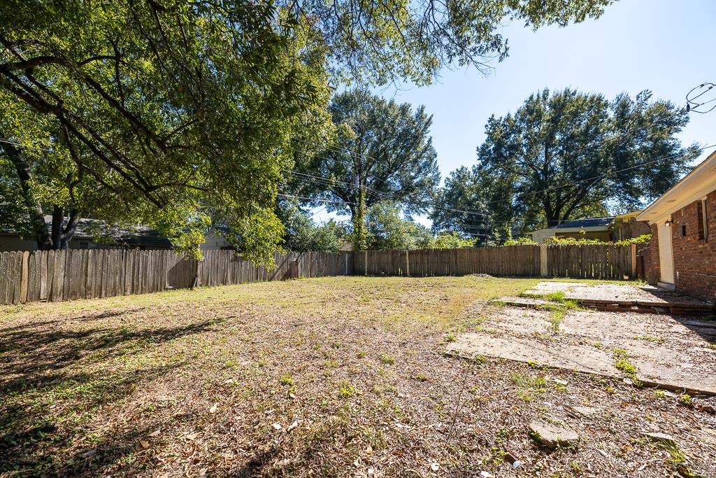 4512 Applegate Road Memphis, TN 38109 - Photo 30 of 31 a backyard of a house