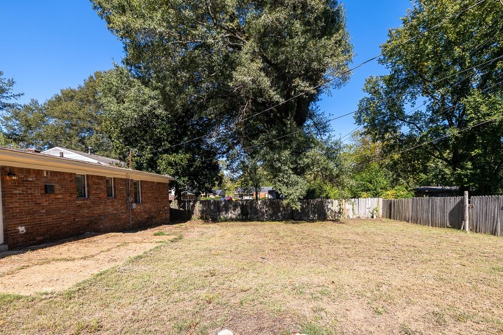 4512 Applegate Road Memphis, TN 38109 - Photo 6 of 31 a view of a house with a yard covered in snow
