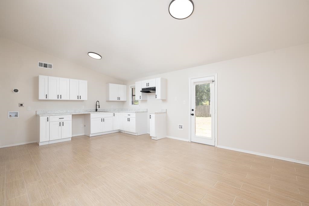 4512 Applegate Road Memphis, TN 38109 - Photo 10 of 31 a large white cabinet with white cabinets