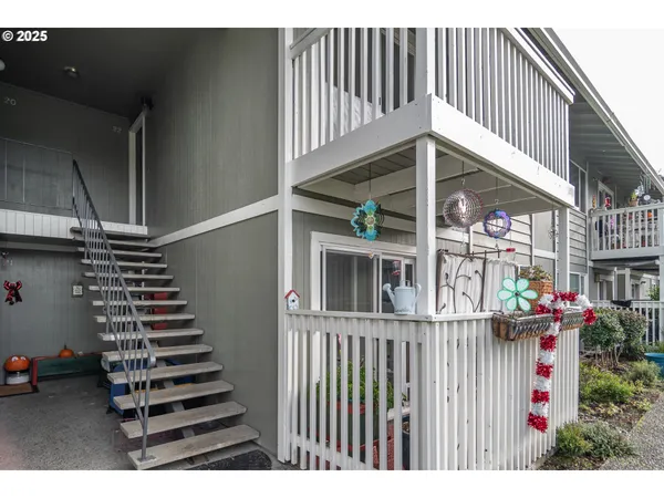 a view of a house with entryway and wooden floor