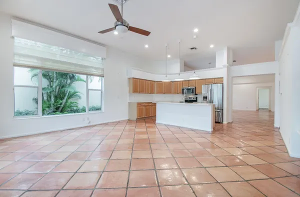 a view of a kitchen with furniture and a window