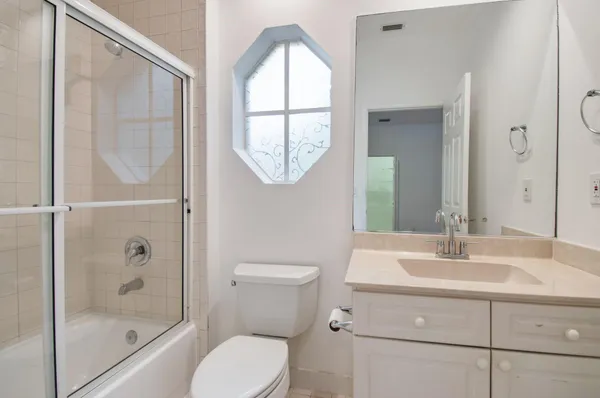 a bathroom with a sink and mirror