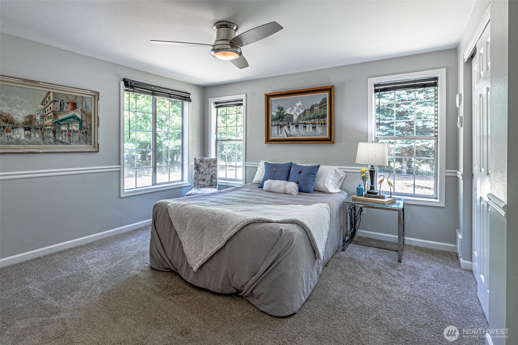 18920 217th Avenue East Orting, WA 98360 - Photo 17 of 36 a bedroom with a large bed and a window