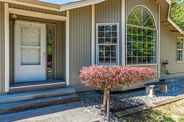 a front view of a house with garden