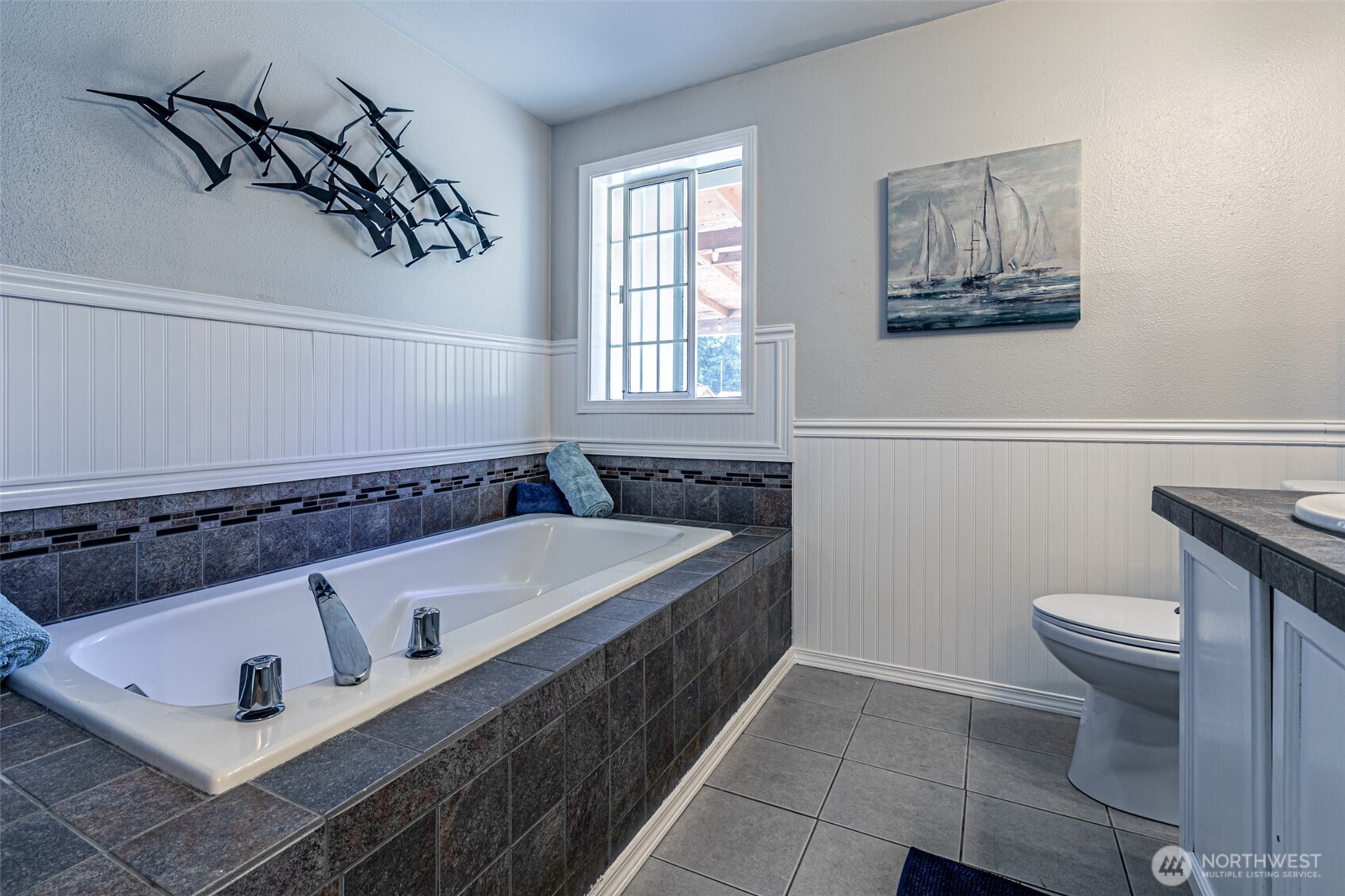 18920 217th Avenue East Orting, WA 98360 - Photo 21 of 36 a bathroom with a bathtub and a toilet