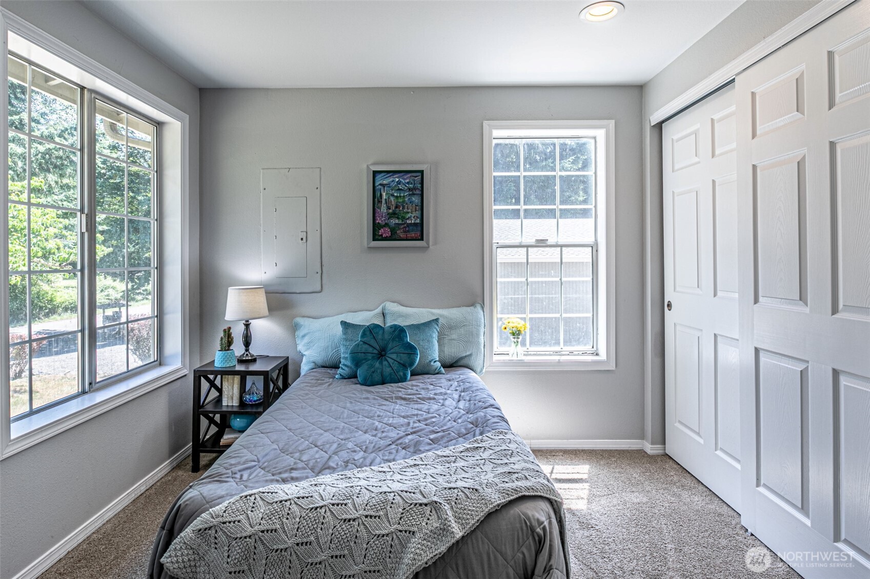 18920 217th Avenue East Orting, WA 98360 - Photo 22 of 36 a bed sitting in a bedroom next to a window