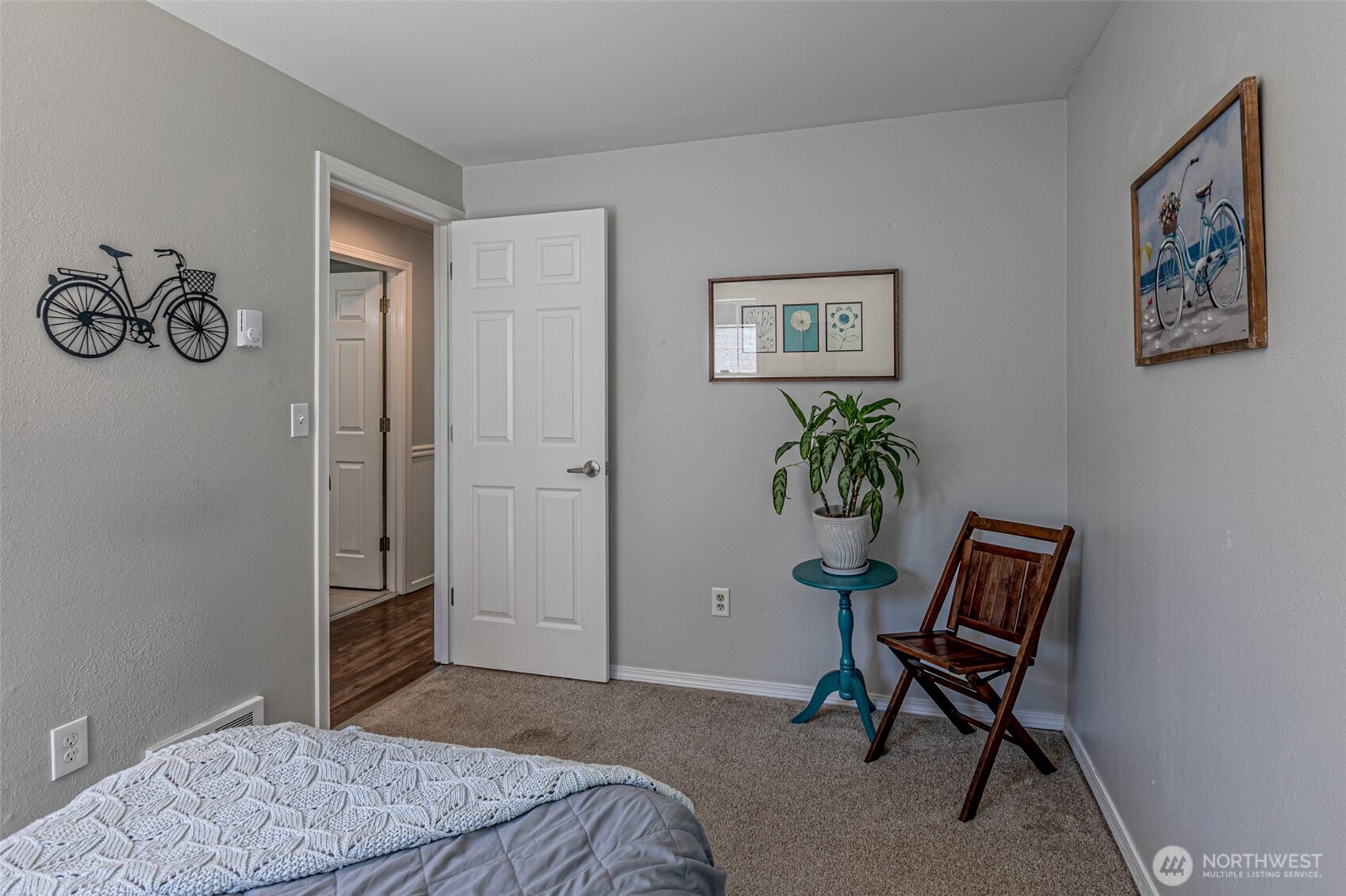 18920 217th Avenue East Orting, WA 98360 - Photo 23 of 36 a bedroom with a bed and a chair