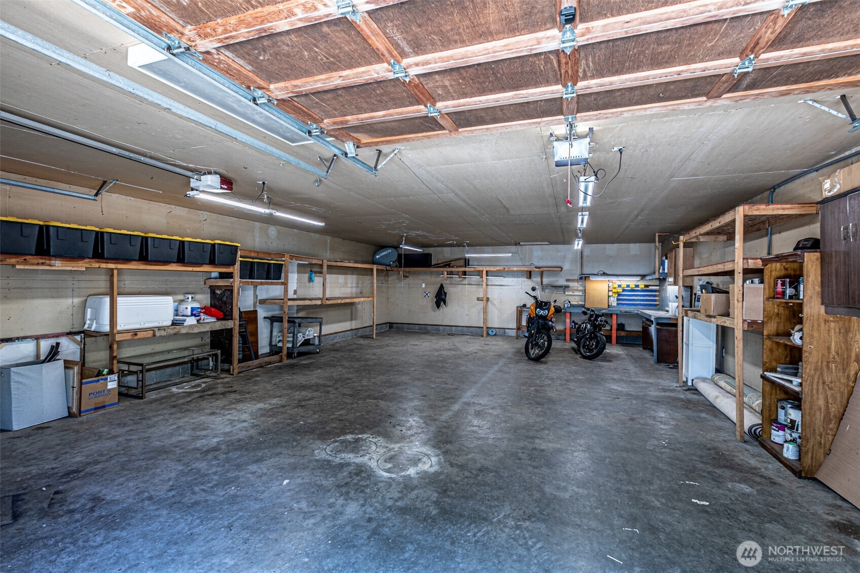 18920 217th Avenue East Orting, WA 98360 - Photo 29 of 36 a view of a garage with a bike and car
