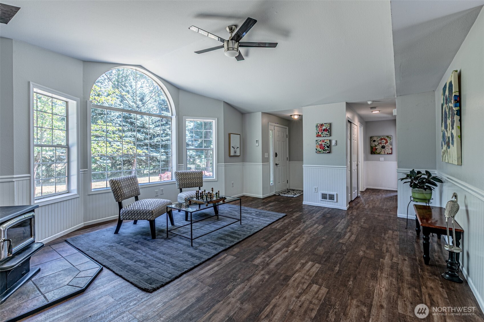 18920 217th Avenue East Orting, WA 98360 - Photo 3 of 36 a living room with furniture floor to ceiling window and wooden floor