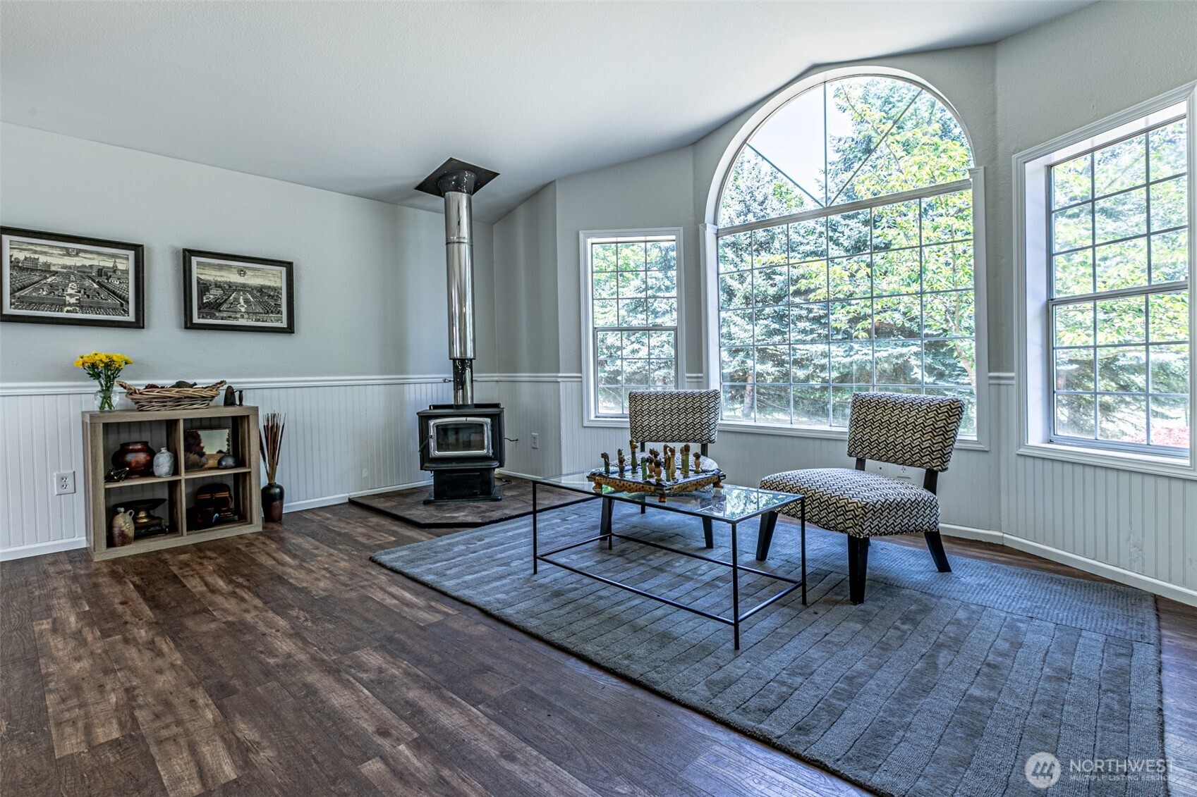 18920 217th Avenue East Orting, WA 98360 - Photo 5 of 36 a living room with furniture a large window and a flat screen tv