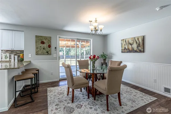 a view of a dining room with furniture window and wooden floor