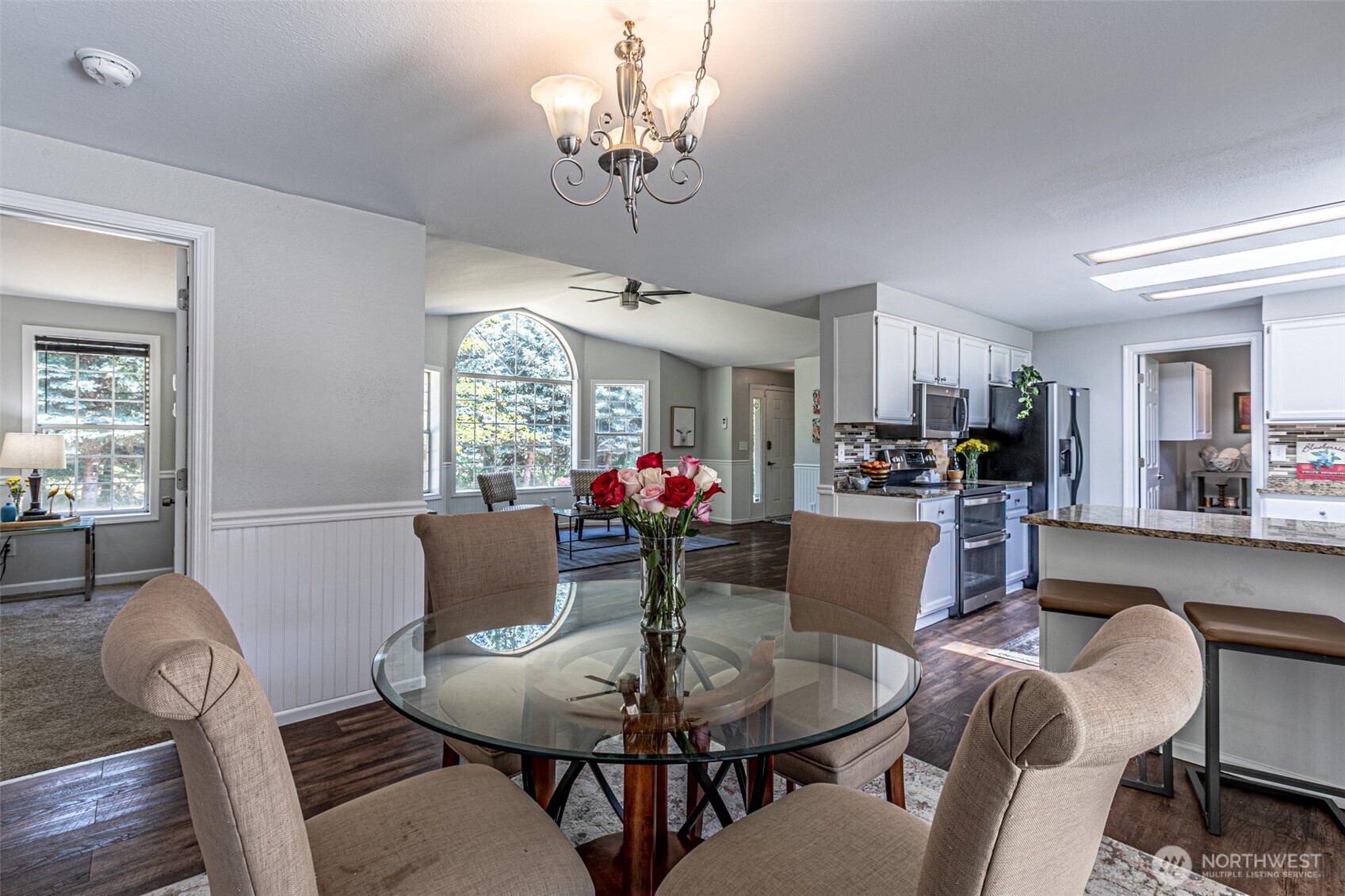 18920 217th Avenue East Orting, WA 98360 - Photo 10 of 36 a dining room with furniture a chandelier and window