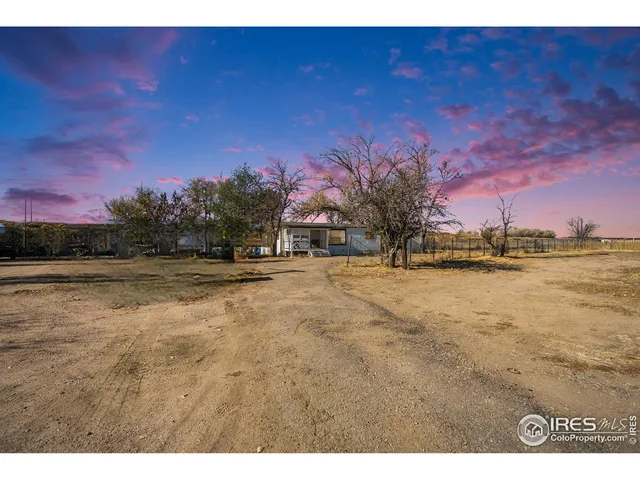 a view of swimming pool with outdoor seating